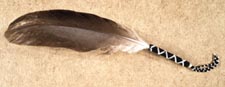 Photograph of eagle feather with beaded quill