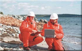 Responders use laptop computers to access computerized sensitivity maps during an environmental emergency on the Atlantic coast.