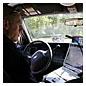 Photo of a police officer inside a police vehicle