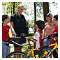 Photo of a police officer talking to children in a park