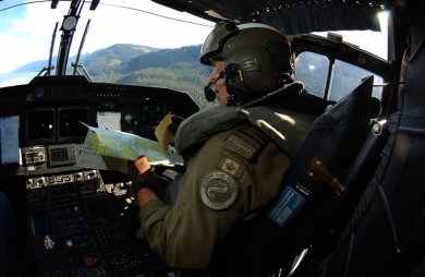 Captain Doug Parker, a Cormorant pilot at 442 Squadron, 19 Wing Comox, verifies coordinates priorto flying a square grid reference.This flying pattern is used typically in search and rescue missions to locate people, boats or downed aircraft.