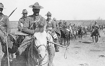 Boer War Picture, The 2nd Regiment, Canadian Mounted Rifles on patrol in South Africa, February ? March 1902. Note the rather bedraggled appearance of some of the Stetsons, the Orndorff bandoliers, and Mark 1 Lee-Enfield rifles. NAC PA173029
