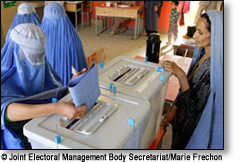 A woman casts her ballot
 Joint Electoral Management Body Secretariat/Marie Frechon