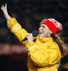 Half-time diva: Shania Twain waves to the crowd during the half-time show at the 2002 Grey Cup in Edmonton. CP Photo/Adrian Wyld.