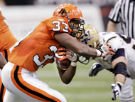 The Lions' Joe Smith, left, avoids a tackle by the Blue Bombers' Doug Brown during Saturday's game in Vancouver. 