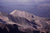 Figure A24. Pyramid DomePyramid Dome is a relatively young dome on the northwest flank of Mount Edziza. The dome represents just one of the several different styles of volcanism found in the Mount Edziza volcanic complex. (Photograph by C.J. Hickson (Geological Survey of Canada))