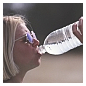 Photo of women drinking water from bottle