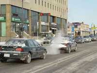Car emissions on a city street