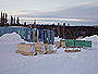 Here we see the temporary storage containers and in front are some komateks  used for the move to Natuashish.