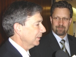 Premier Pat Binns (left) and Minister Strahl speak with reporters following their meeting in Charlottetown