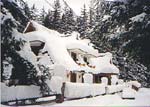 Snow-covered cottage