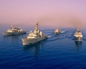HMCS FREDERICTON (right), HMCS IROQUOIS (centre forward), HMCS REGINA (left) and HMNZS Te Mana ( A New Zealand warship positioned rear) sail in a diamond formation in the Arabian Gulf. 