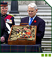 Gordon Campbell, Premier of British Columbia, takes possession of the bagpipes belonging to Piper James Richardson, VC, on behalf of the province.