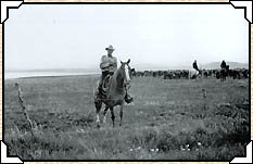A Bar U Ranch cowboy on his horse