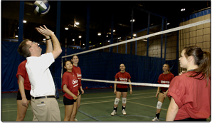 Minister of Health Promotion Jim Watson joins Team Ontario and University of Toronto Varsity volleyball team members in drills at the University?s Field House after announcing $1.2 million for coach training to support amateur athletes.