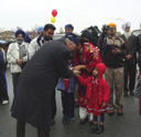 Premier greets a young celebrant outside the Ross Street Temple