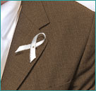 Photo of a lapel with a white ribbon