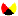 A small a red, white yellow and black bullet