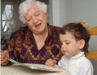 Senior reading to grandchild