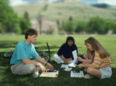 Photo of students studying outdoors