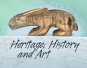 Text: Heritage, History and Art. Photo: A carving in walrus ivory of an Arctic hare.