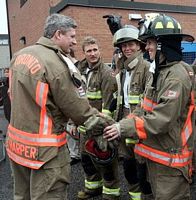 Prime Minister Stephen Harper meets with Toronto firefighters: disasters demand common approaches to a broad spectrum of emergency management efforts