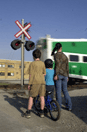 Family stopped at a railway crossing