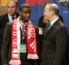 Maurice Edu is greeted by MLS Commissioner Don Garber, right, after he was selected as the No. 1 overall pick by Toronto FC in the MLS SuperDraft in January. (Tom Strattman/Associated Press)
             