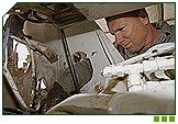Corporal Jay Dance works on an armoured vehicle engine.