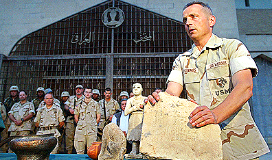 U.S. Colonel Matthew Bogdanos presents retrieved treasures stolen from the Museum. Photo Behrouz Mehri/AFP/Getty Images.