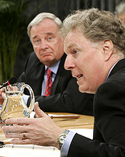 Prime Minister Paul Martin listens to Quebec Premier Jean Charest address his provincial counterparts at the First Ministers Conference on Health in Ottawa on Tuesday, September 14, 2004.(CP PHOTO/Tom Hanson)
