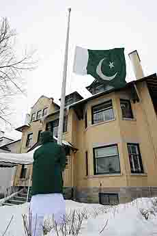 The Pakistan flag is lowered in front of the Pakistan Embassy in Ottawa on Thursday, following the assassination of former prime minister Benazir Bhutto. 