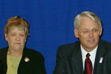 Premier Gordon Campbell speaks with small business owners from Port Alberni at a small business roundtable in the Vancouver island community on March 17, 2003. Small business account for 98 per cent of all companies in B.C., including more than 1,000 small businesses in the Port Alberni region. To the left of Premier Campbell is Alberni-Qualicum MLA Gillian Trumper.