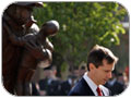 Premier McGuinty pauses at the memorial to honour fallen firefighters.