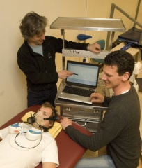 Dr. Fabien Basset, left, and Chad Workman record the basal metabolic rate of grad student Geoff Power.