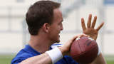Indianapolis Colts quarterback Peyton Manning tosses a ball prior to the start of practice at the Miami Dolphins training facility in Davie, Florida February 5, 2010. The Colts are preparing to meet the New Orleans Saints in Super Bowl XLIV Sunday. REUTERS/Hans Deryk