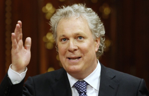 Quebec Premier Jean Charest waves after he unveiled his cabinet at the National Assembly in Quebec City on Dec. 18, 2008. 
