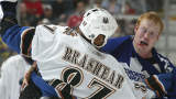 File photo: Donald Brashear #87 of the Washington Capitals fights Wade Belak #3 of the Toronto Maple Leafs during their NHL game at the Air Canada Centre December 23, 2006 in Toronto, Ontario. (Photo by Dave Sandford/Getty Images)