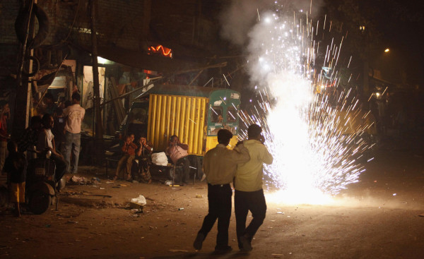 Residents light fireworks on the Hindu festival of Diwali in Delhi on Saturday. 