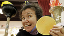 Muriel Marjorie shows off her gold medal during the Poverty Olympics, held to protest against the amount of money spent on the Winter Games, on Feb. 7, 2010 in Vancouver.