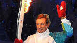 Former hockey great Wayne Gretzky waves as he carries the Olympic torch during the Opening Ceremony of the 2010 Vancouver Winter Olympics at BC Place on February 12, 2010 in Vancouver, Canada. Getty Images / Robyn BECK