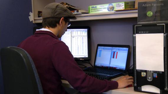 Photo - Man working at a computer