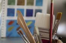 Photo – Paint brushes and other art equipment