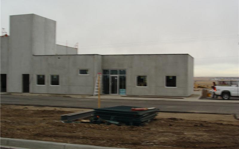 Photo - The building is coming together nicely as the windows, doors and garage bay doors are installed.