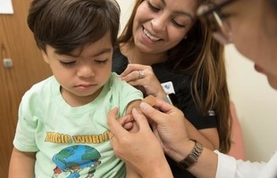 Child receiving vaccination.